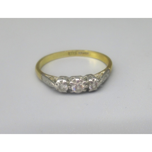 73 - 18ct yellow gold three stone diamond ring, the diamonds in illusion settings, stamped 750, O1/2, 2.6... 