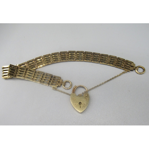 93 - 9ct yellow gold five bar gate bracelet, with heart padlock clasp and safety chain, stamped 375, 15.7... 