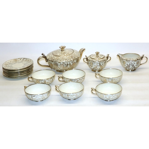 858 - Bavarian type porcelain tea ware with silver overlay, comprising teapot, H11cm, six cups and saucers... 