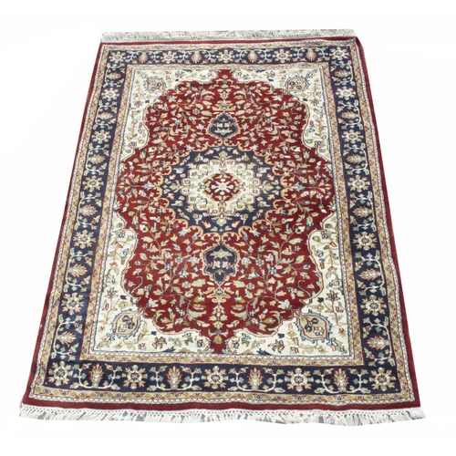 861 - Persian pattern multicoloured wool rug, triple shaped medallion floral field in multi repeat striped... 