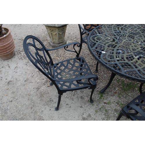 1466 - Large garden circular metal table with pierced work design on four legs with central stretcher and s... 