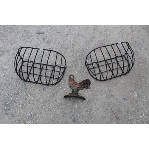 1468 - Pair of ornamental hayracks, approx W59cm D28cm and a quality cast painted flat back doorstop in the... 