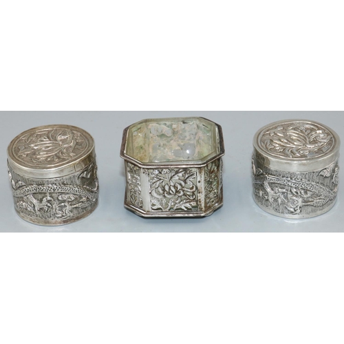 1166 - Pair of early C20th Chinese silver dressing table pots, cylindrical bodies relief decorated dragons,... 