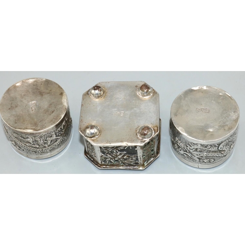 1166 - Pair of early C20th Chinese silver dressing table pots, cylindrical bodies relief decorated dragons,... 