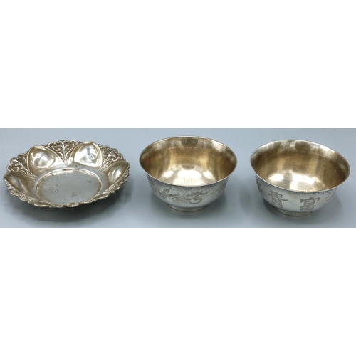 1128 - Pair of C20th Chinese silver circular bowls, decorated with character marks and foliage and birds, D... 