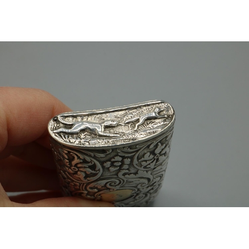 1085 - George V hallmarked silver rectangular snuff box with curved bas, all over repousse with hunting sce... 