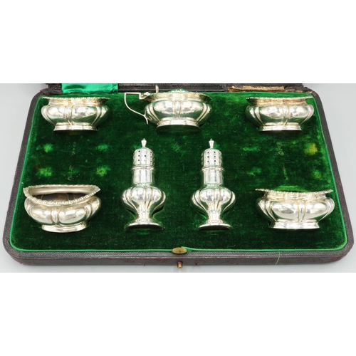 1126 - Victorian hallmarked silver seven piece cruet set, lobed bodies with gadrooned borders by Walker & H... 