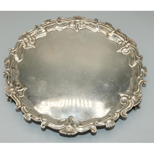 1204 - George III style hallmarked silver circular salver, with S scroll and fan raised border on claw and ... 