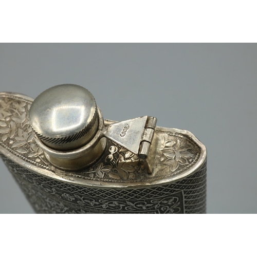 1127 - C20th silver hip flask, curved body decorated with trailing foliage in hatched border, hinged screw ... 