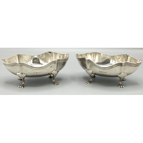 1095 - Pair of George V hallmarked silver oval dishes with reeded rims on four paw feet, by A Zimmerman Ltd... 