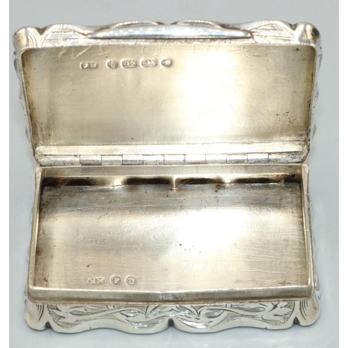 1145 - Victorian hallmarked silver shaped rectangular snuff box, all over engraved with scrolls and vacant ... 