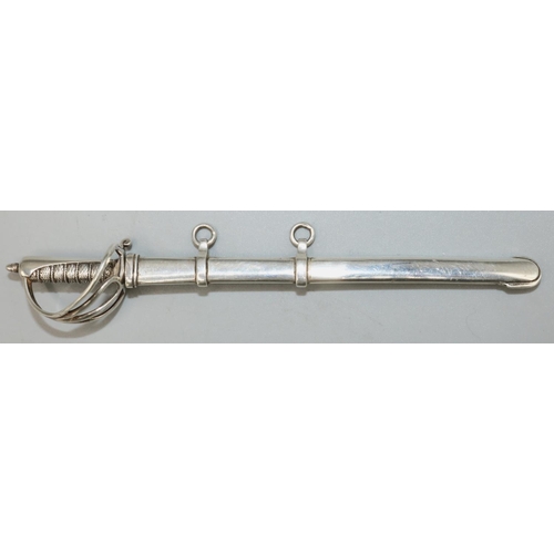 Victorian hallmarked silver miniature presentation sword, with scroll pierced guard in scabbard, by Samson Morden & Co London 1895, L15cm max