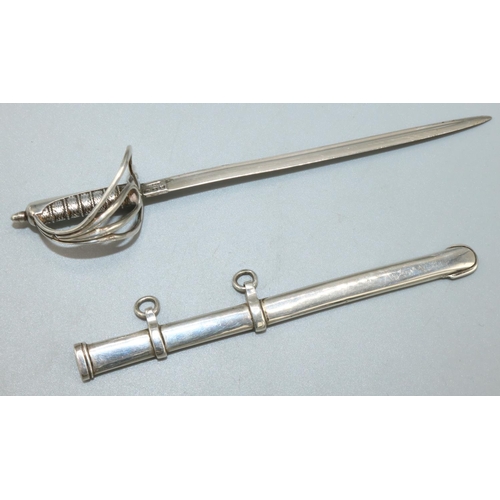 1091 - Victorian hallmarked silver miniature presentation sword, with scroll pierced guard in scabbard, by ... 