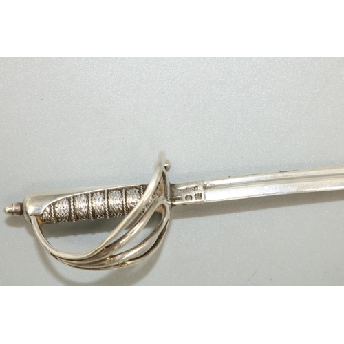 1091 - Victorian hallmarked silver miniature presentation sword, with scroll pierced guard in scabbard, by ... 