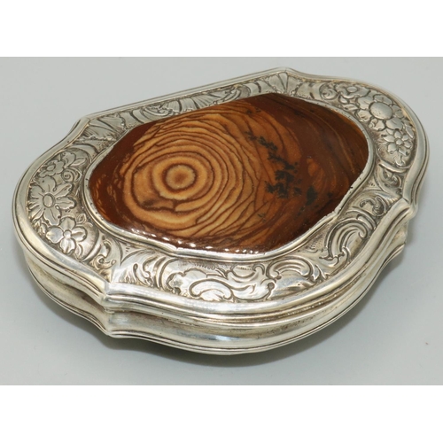 1107 - George III serpentine D shaped table snuff box, hinged lid inset with a polished brown agate panel w... 