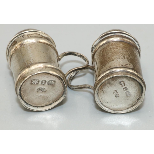 1172 - Pair of Victorian hallmarked silver pepperettes, modelled as flour dredgers probably by Joseph Whitt... 