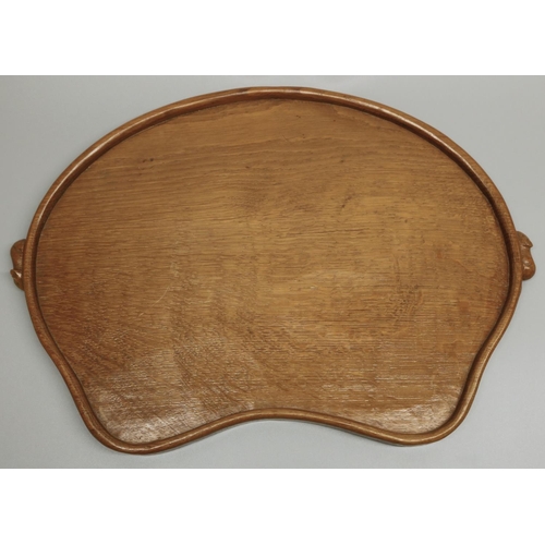 1417 - Robert Mouseman Thompson of Kilburn - an adzed oak kidney shaped galleried tray, carved with two sig... 