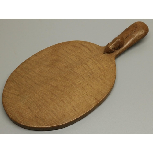 1420 - Robert Mouseman Thompson of Kilburn - an oak oval cheese board, curved handle carved with signature ... 