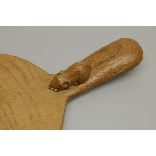 1420 - Robert Mouseman Thompson of Kilburn - an oak oval cheese board, curved handle carved with signature ... 