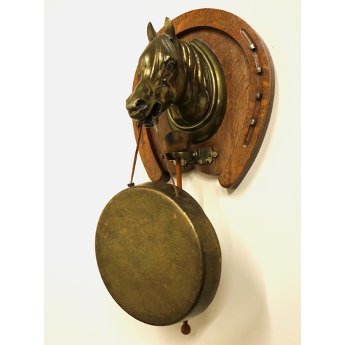 1280 - Edwardian oak and brass dinner gong, cast heavy horse mount on horseshoe shaped oak mount set with b... 