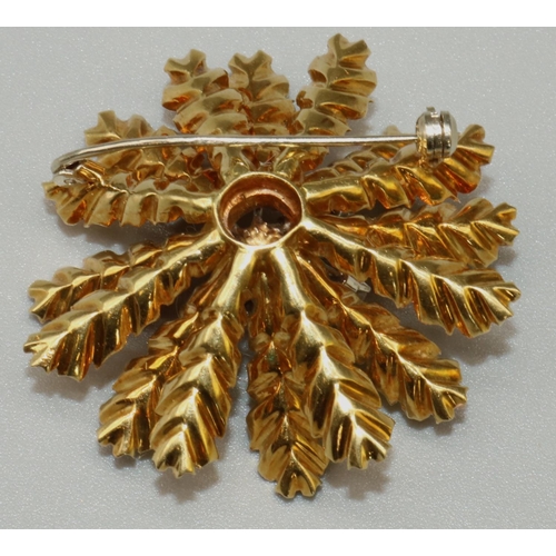 1013 - Mid C20th 18ct yellow gold brooch in the form of a stylised flower head, around a centre of thirteen... 