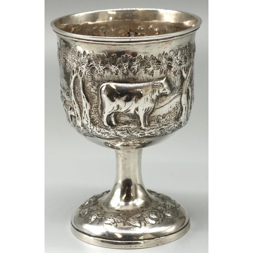 1119 - Victorian hallmarked silver goblet, bowl repousse with bucolic study of a cow in wooded rural landsc... 