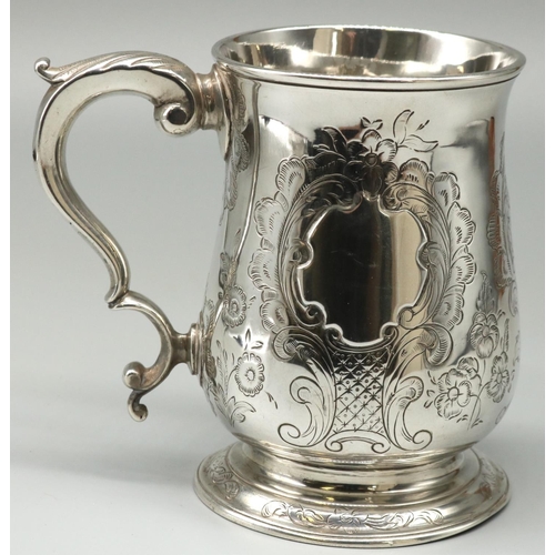 1096 - George III hallmarked silver mug, baluster body decorated with foliage scrolls and vacant cartouche,... 