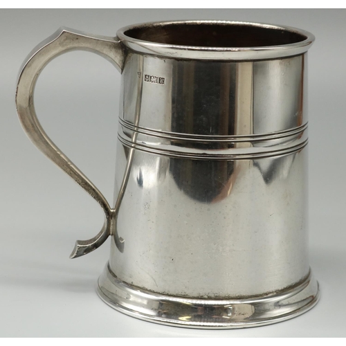 1073 - Elizabeth II hallmarked silver Georgian style mug, plain tapering with reeded band and S scroll hand... 