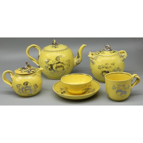 1227 - Leeds Pottery tea service, decorated in silver lustre with fruit and foliage on a yellow ground, com... 