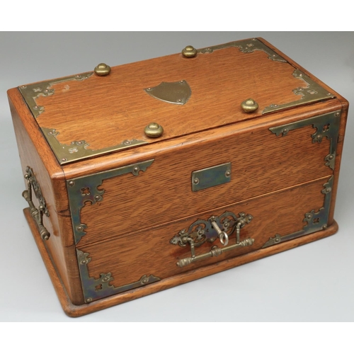 1277 - Edwardian brass bound oak smokers cabinet, hinged lid with cedar liner interior above a fitted drawe... 