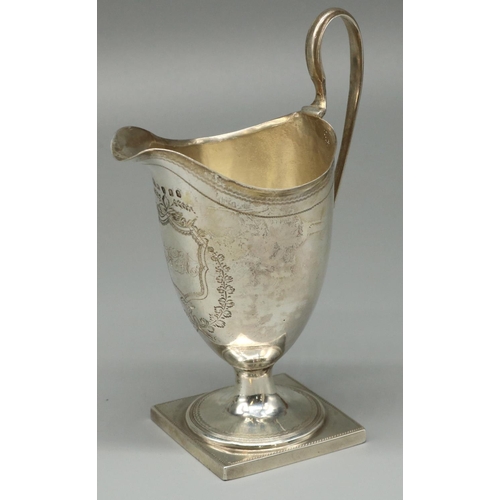 1112 - George III hallmarked silver helmet shaped pedestal cream jug, with dot prick and bright cut decorat... 