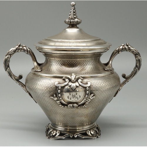 1198 - C19th silver plated urn shaped sugar vase and cover, all over engine turned with spire finial, leaf ... 