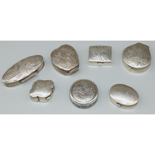 1181 - Collection of seven continental shaped pill boxes, five with engraved hinged lids, two plain, six st... 