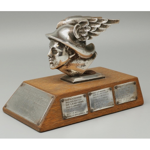 1184 - C20th chromed cast metal head of Hermes, mounted on an oak plinth as a trophy for 'Marton Hall Schoo... 