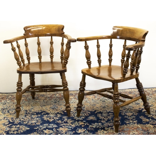 1393 - Pair of beech Smokers Bow type arm chairs, stepped curved backs and saddle moulded seats on turned s... 