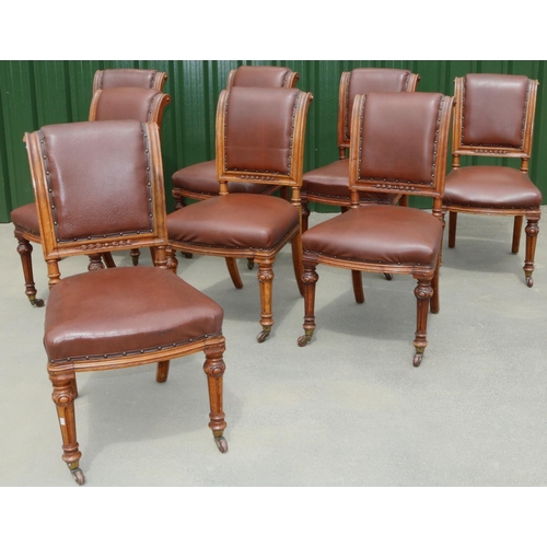 1390 - Set of eight Victorian golden oak dining chairs, with scrolled backs and serpentine seats on cabocho... 