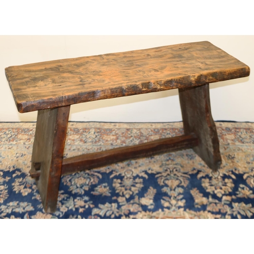 1402 - C20th rustic elm side table, rectangular top on outsplayed solid end supports joined by a pegged str... 