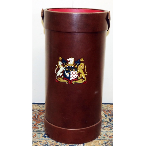 1245 - Brown leather shell case stick stand, with painted crest and swing handle, H51cm