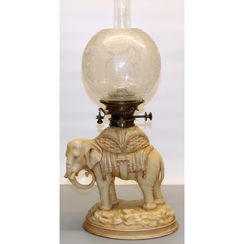 1259 - Victorian porcelain elephant oil lamp by Alfred Stellmacher, with Hinks Duplex brass fitting, clear ... 