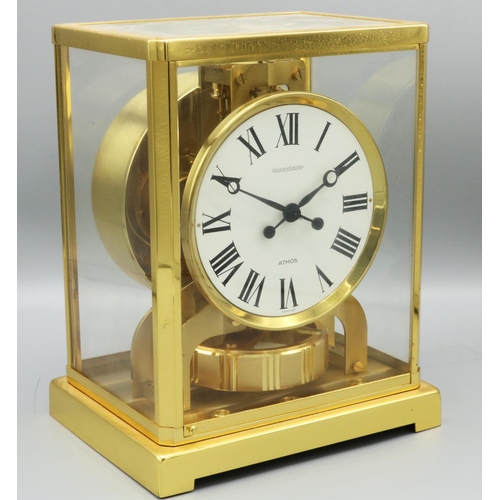 1430 - Jaeger-LeCoultre Classic V Atmos clock, the signed circular white Roman dial, in a gilt brass and gl... 