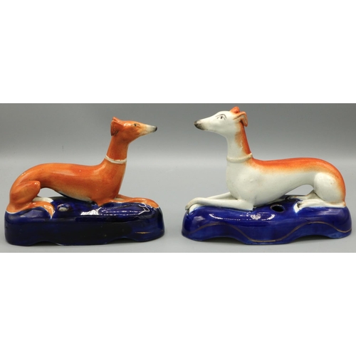 1222 - Two Victorian Staffordshire greyhound pen holders, on blue painted bases, W15cm H13cm (2)