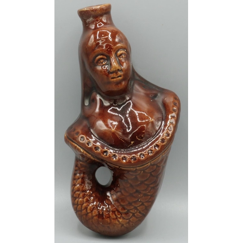 1230 - C19th Staffordshire brown glazed pottery flask, modelled as fish tailed Victoria, H20cm