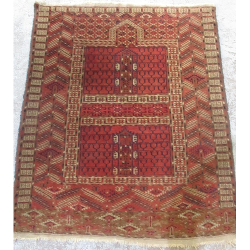 1441 - Caucasian red ground wool prayer rug, with geometric field in repeating geometric hooked striped bor... 