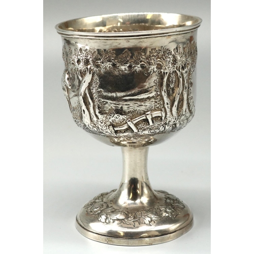 1119 - Victorian hallmarked silver goblet, bowl repousse with bucolic study of a cow in wooded rural landsc... 