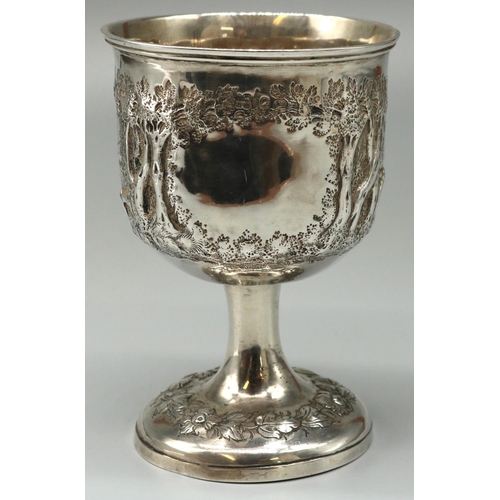 1119 - Victorian hallmarked silver goblet, bowl repousse with bucolic study of a cow in wooded rural landsc... 