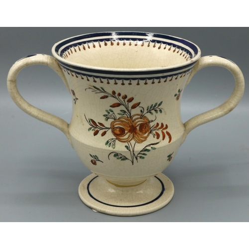 1215 - C20th Prattware loving cup painted 'Peter Bates 1802' in floral wreath, H13cm