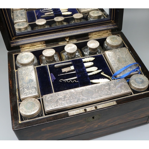 1240 - Victorian coromandel vanity case, fitted interior with ten engraved and initialled silver topped cle... 