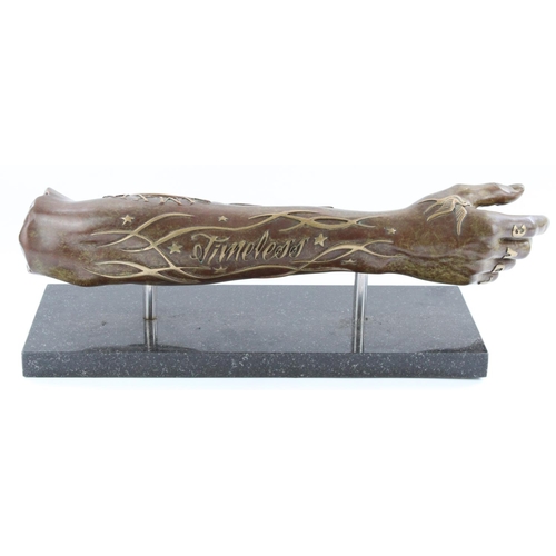 1258 - Dan Lane (British b1980-); 'Timeless', bronze sculpture of forearm with tattoos in relief, on slate ... 