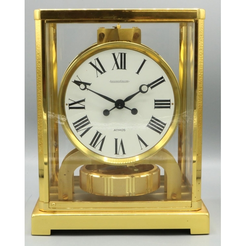 1430 - Jaeger-LeCoultre Classic V Atmos clock, the signed circular white Roman dial, in a gilt brass and gl... 