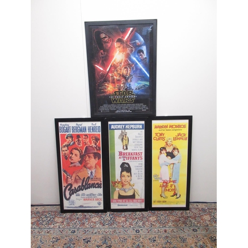 167 - Three framed John Lewis Movie posters and a framed Star Wars The Force Awakens poster (4)